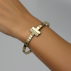 Bracelete T Dourado Aço Inox Antialérgico