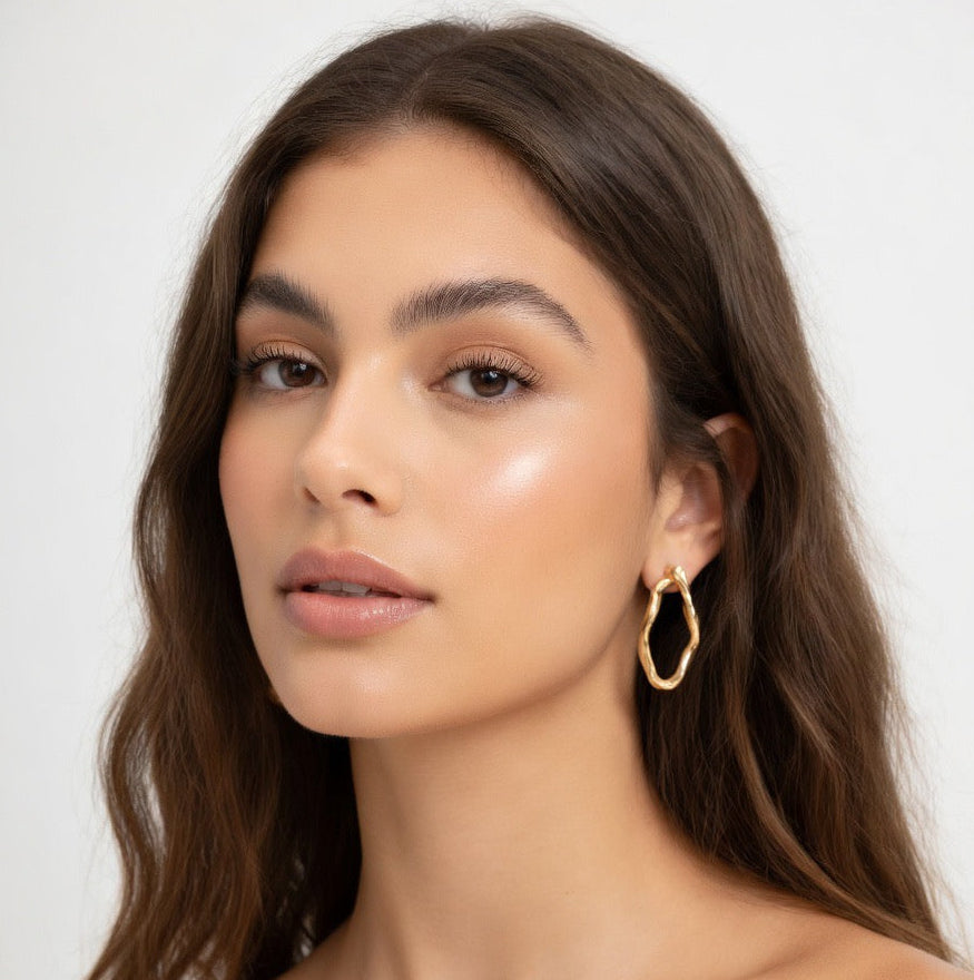 Brinco circular fluxo dourado - aço inoxidável