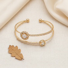 Bracelete dourado aro duplo com zircônias em caixa de apresentação.